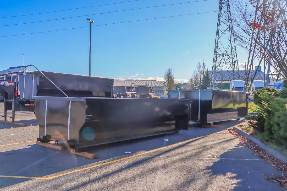 Roll-off dumpster ready for waste disposal at job site for 2 Yard Dumpster Rental in Rocky Mount